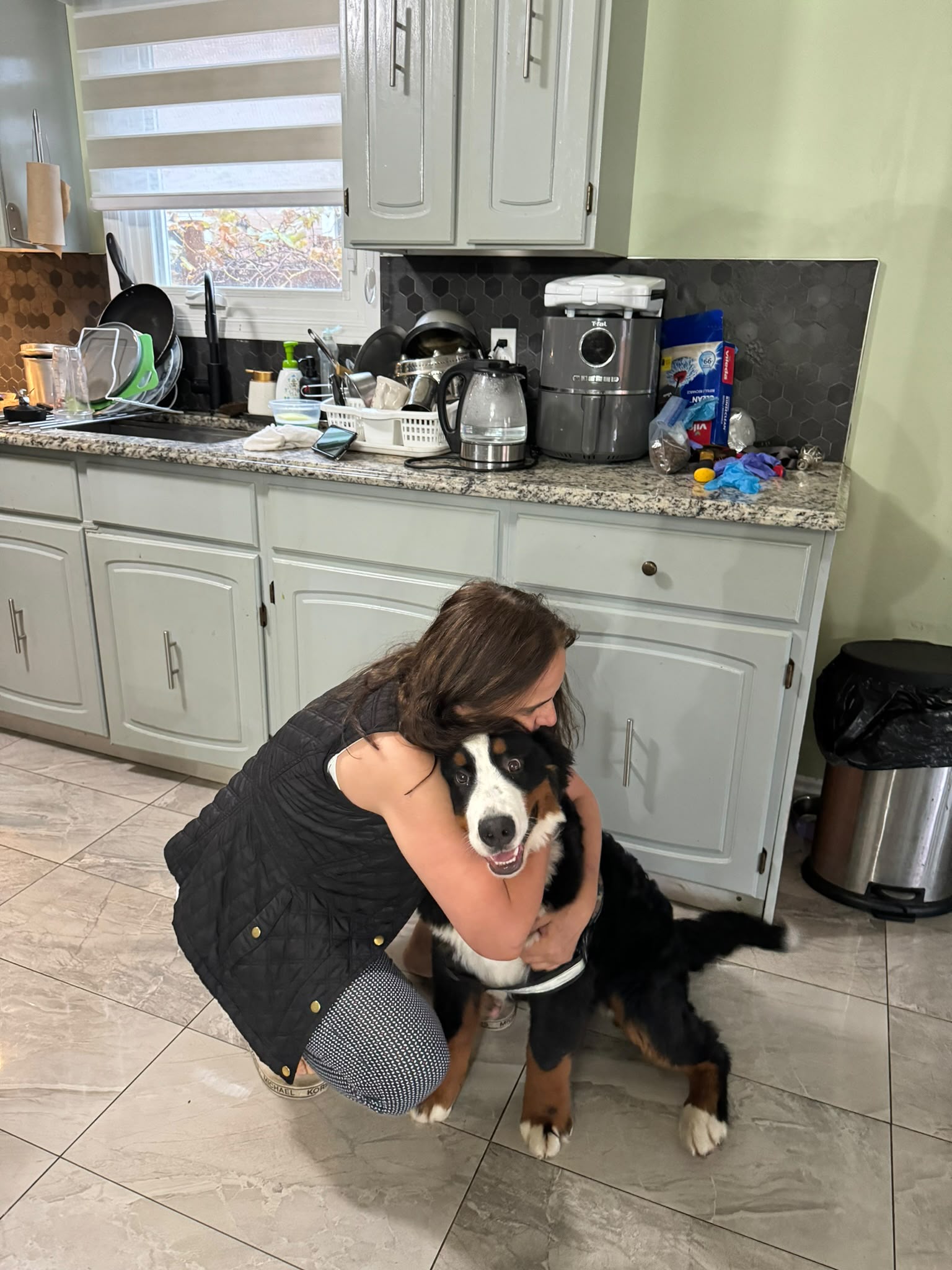 Paola caring for a dog in a home-style environment